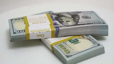 Stack of bank bundles with US dollars on a white background. Close-up shot of Stock Footage 244910319