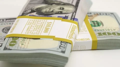 Stack of bank bundles with US dollars on a white background. Close-up shot of Stock Footage 245064881