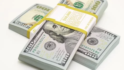 Stack of bank bundles with US dollars on a white background. Close-up shot of Stock Footage 245265071