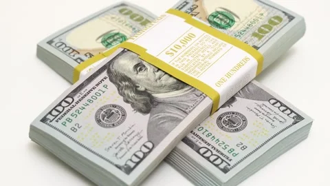 Stack of bank bundles with US dollars on a white background. Close-up shot of Stock Footage 245342914