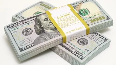 Stack of bank bundles with US dollars on a white background. Close-up shot of Stock Footage 245608232