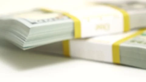 Stack of bank bundles with US dollars on a white background. Close-up shot of Stock Footage 246113525