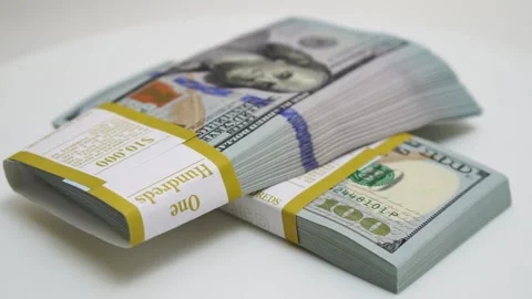 Stack of bank bundles with US dollars on a white background. Close-up shot of Stock Footage 246285359