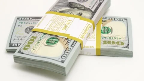Stack of bank bundles with US dollars on a white background. Close-up shot of Stock Footage 246582435