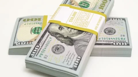 Stack of bank bundles with US dollars on a white background. Close-up shot of Stock Footage 246732695