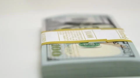 Stack of bank bundles with US dollars on a white background. Close-up shot of Stock Footage 246850004