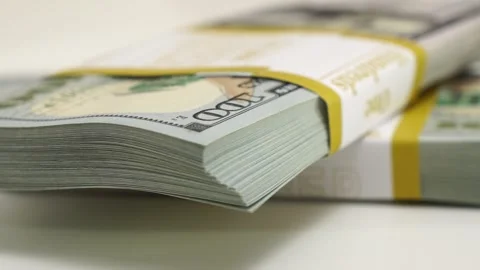 Stack of bank bundles with US dollars on a white background. Close-up shot of Stock Footage 247116252