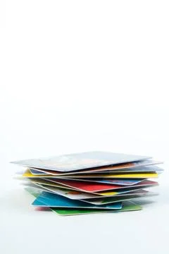 Stack of bank cards on a white background. Stock Photos