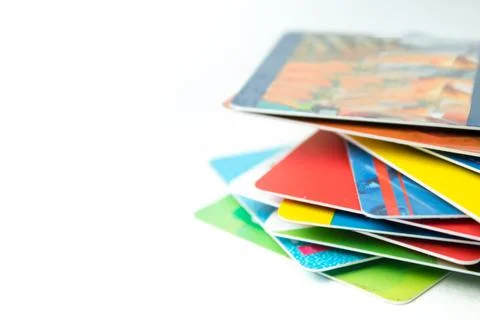 Stack of bank cards on a white background. Stock Photos