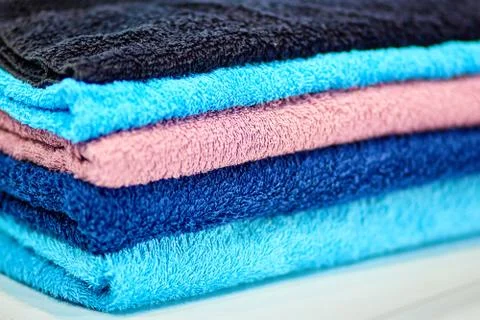 Stack bath towels colorful textile background closeup Stock Photos