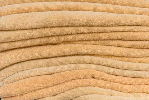 Stack of bath towels on wooden table Stock Photos