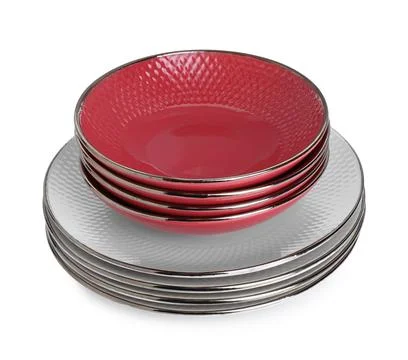 Stack of beautiful ceramic plates and bowls isolated on white Stock Photos