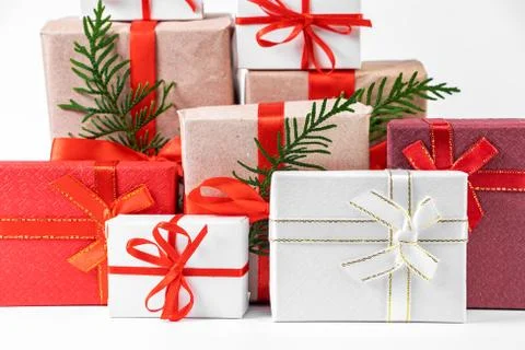 Stack of beautiful gift boxes on white background. Festive New Year concept. Stock Photos