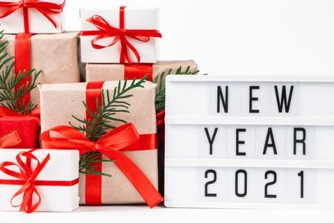 Stack of beautiful gift boxes on white background. Festive New Year concept. Stock Photos