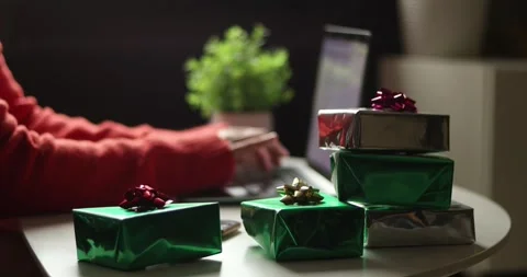 Stack of beautifully wrapped gifts with festive bows, ready for celebration Stock Footage 339072312
