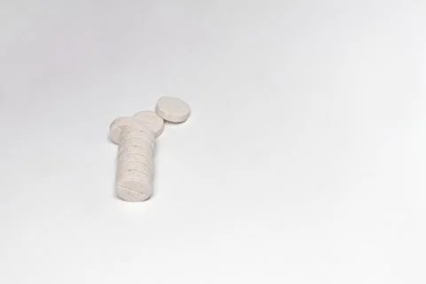 A stack of beige pills with inclusions and a dividing line Stock Photos