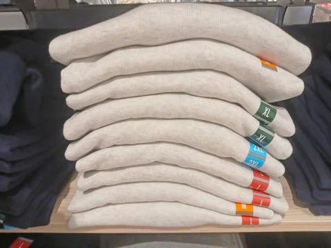 A stack of beige things lies on a shelf Fotos de archivo