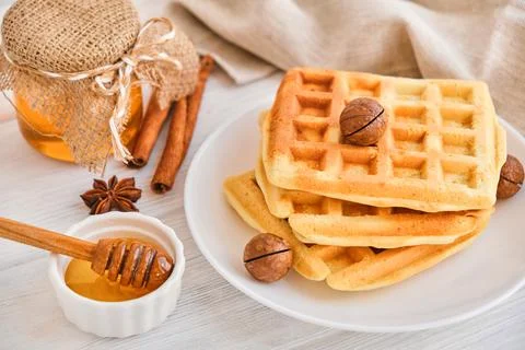 Stack of Belgian waffles on a white plate. Stock Photos