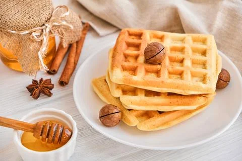Stack of Belgian waffles on a white plate. Stock Photos