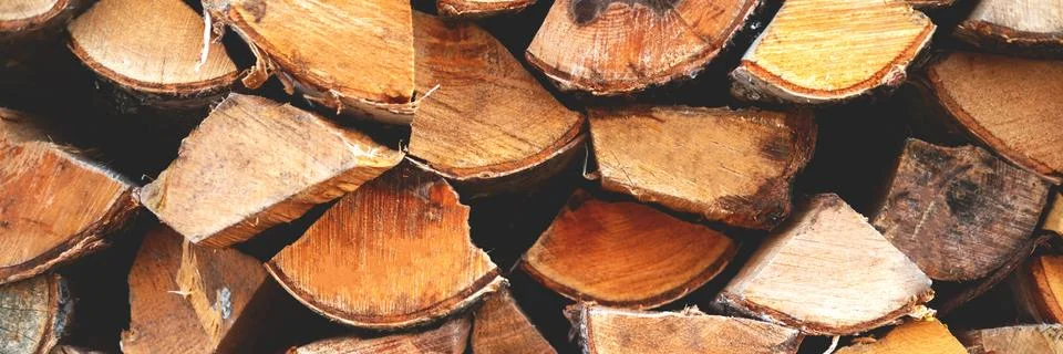 The stack of birch chopped billet with the flow focus. Stock Photos