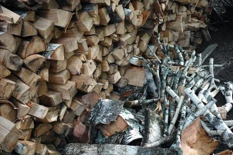Stack of birch chopped firewood Stockfoto's