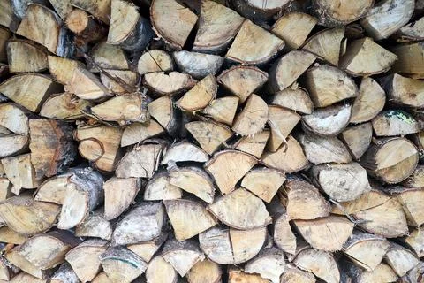 Stack of birch firewood with hand chopping block. Chopped firewood for wint.. Stock Photos