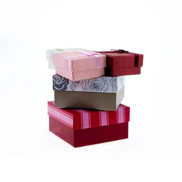 Stack of birthday gifts on isolated white background, red and pink giftbox Stock Photos