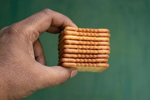 Stack of Biscuits in Hand 스톡 사진