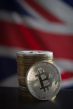 Stack of bitcoins and flag of the United Kingdom Stock Photos