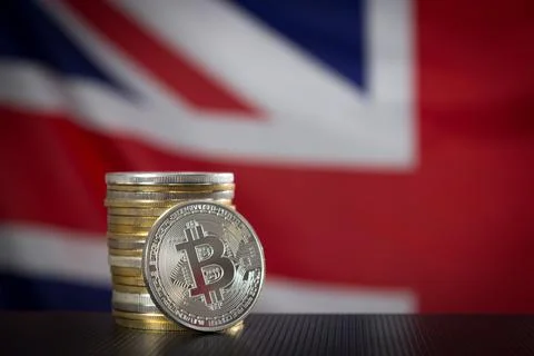 Stack of bitcoins and flag of the United Kingdom Stock Photos