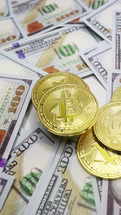 Stack of Bitcoins on Dollar Bills. Stock Footage 289434747