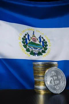 Stack of bitcoins over El Salvador flag. Stock Photos