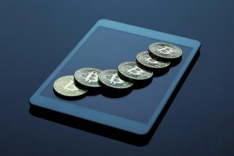 Stack of bitcoins on a tablet computer Stock Photos