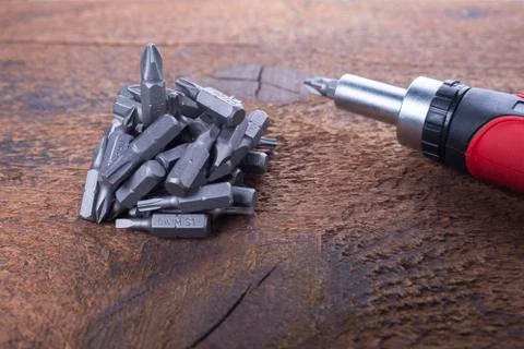 Stack of bits for screwdriver or drilling machine on the wood Stock Photos