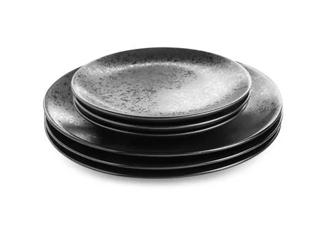 Stack of black ceramic plates isolated on white Stock Photos