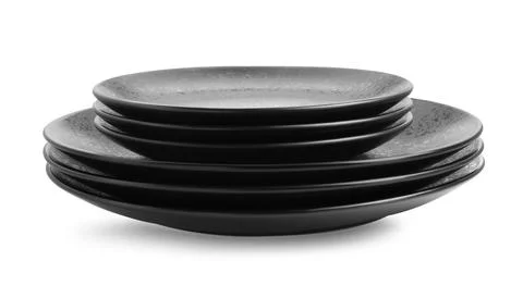 Stack of black ceramic plates isolated on white Stock Photos