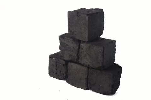 Stack of Black Charcoal Briquettes for Grilling Amid White Background 写真素材