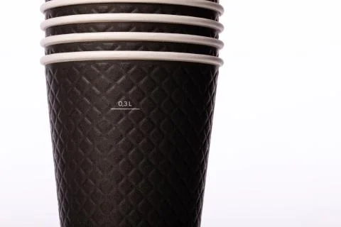Stack of black disposable biodegradable paper takeaway cups 0,3 L close up Stock Photos