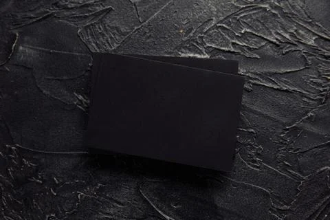 Stack of black envelopes on a dark background Foto stock