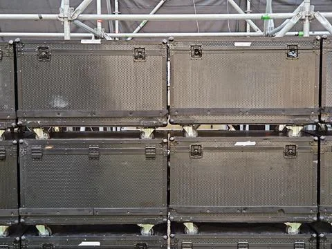 Stack of black flight cases on wheels used for concert and event production 스톡 사진