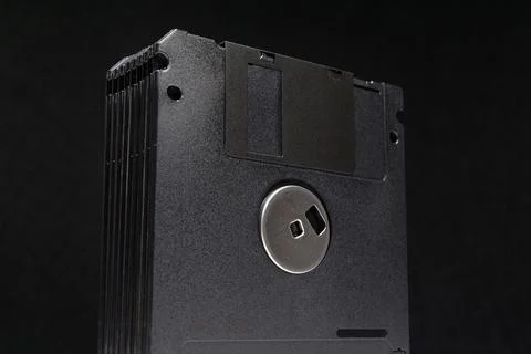 Stack of black floppy disks used for magnetic data storage in retro computers Stock Photos