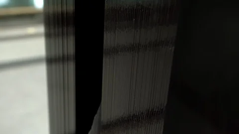 A stack of black glass panels in the warehouse. Stack of glass sheets in Stock Footage 124060644