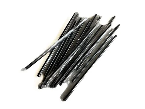 Stack of black plastic drinking straws 스톡 사진