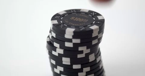 Stack of black poker chips put down on table Stock Footage 112329567
