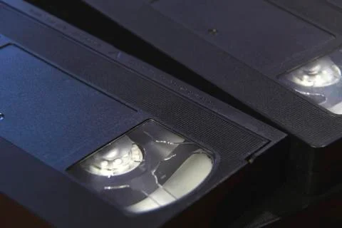 Stack of black VHS tape video cassettes close up Stock Photos