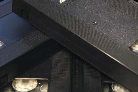 Stack of black VHS tape video cassettes close up Foto stock