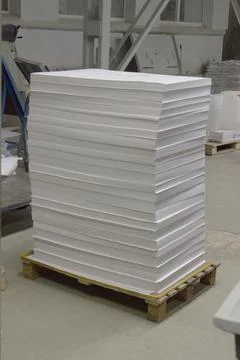 Stack of blank offset paper on a pallet is ready for printing Stock Photos