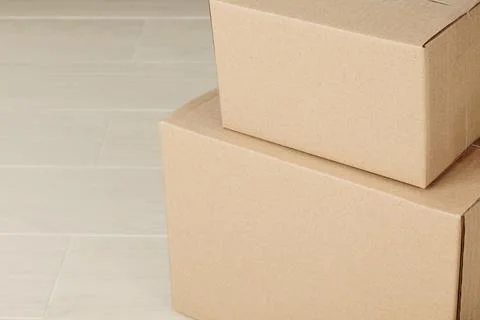 Stack of blank paper cardboard box mockup on the floor, Packaging template Stock Photos