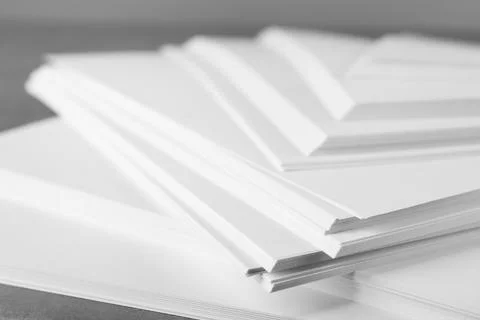 Stack of blank paper on grey table, closeup Foto stock