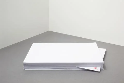 Stack of blank paper with heart shape on one piece Stock Photos